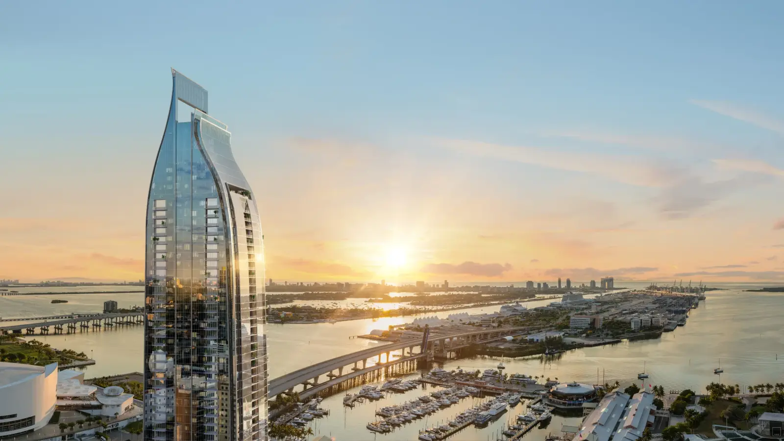 Render de la torre Delano Residences Miami sobre la bahía de Biscayne al atardecer